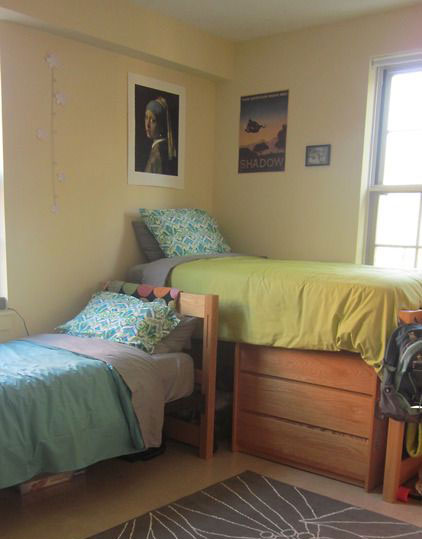Dorm beds arranged in an L shape